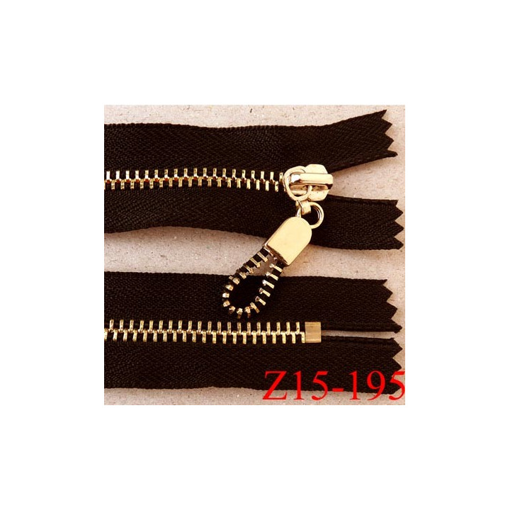 fermeture zip longueur 15 cm couleur noir non séparable largeur 3.2 cm glissière métal doré  largeur 6 mm très belle