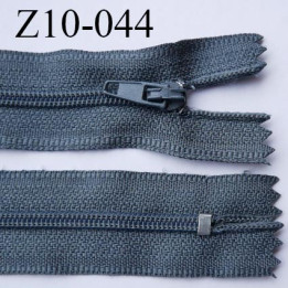 fermeture zip longueur 10 cm couleur bleu tirant sur le gris non séparable largeur 2.4 cm glissière nylon largeur  4 mm