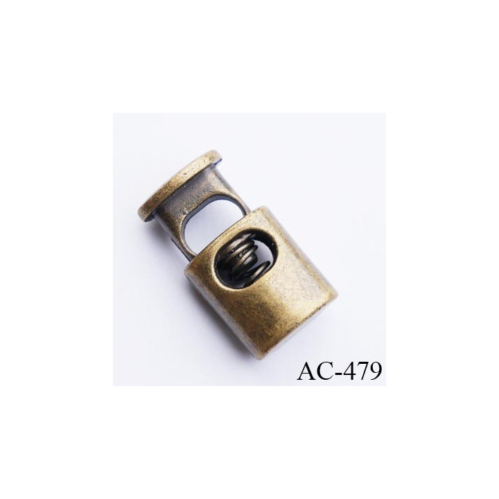 Stop cordon jusqu'au 5 mm couleur laiton hauteur 21 mm largeur 11.5 mm épaisseur 7.5 mm passage du cordon en largeur 6.5 mm