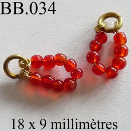 perle  biche de bere  monté  longueur 18 mm largeur 9 mm  couleur orange rouge vendu a la pièce