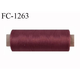 Bobine de fil 500 m mousse polyester n° 110 polyester couleur  lie de vin clair longueur 500  mètres bobiné en France