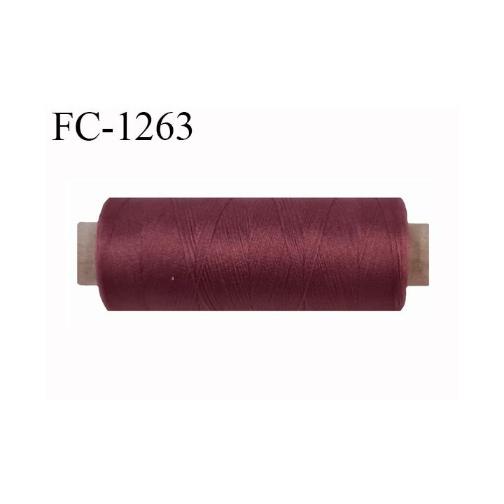 Bobine de fil 500 m mousse polyester n° 110 polyester couleur  lie de vin clair longueur 500  mètres bobiné en France