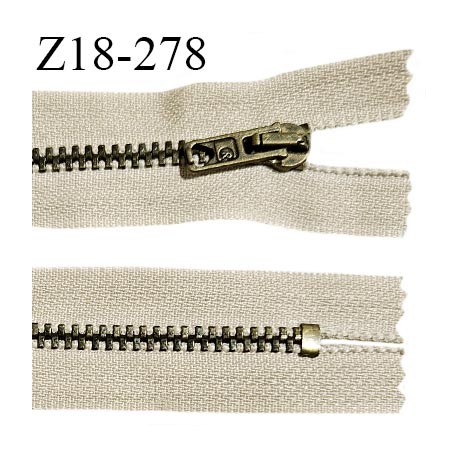 Fermeture zip 18 cm non séparable couleur blanc longueur 18 cm largeur 2.5 cm glissière métal couleur laiton largeur 4.5 mm