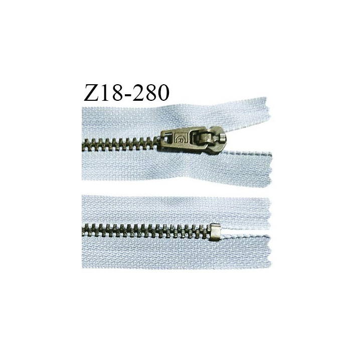 Fermeture zip 18 cm non séparable couleur bleu clair longueur 18 cm largeur 2.5 cm glissière métal couleur laiton largeur 4.5 mm