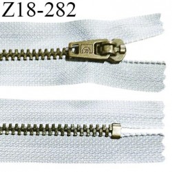 Fermeture zip 18 cm non séparable couleur gris clair longueur 18 cm largeur 2.5 cm glissière métal couleur laiton largeur 4.5 mm