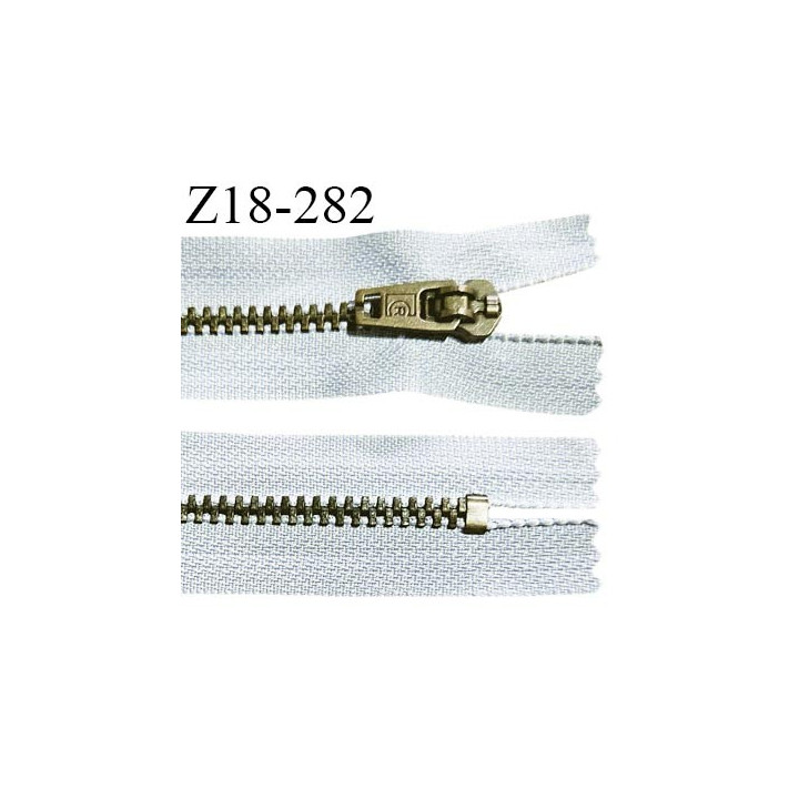 Fermeture zip 18 cm non séparable couleur gris clair longueur 18 cm largeur 2.5 cm glissière métal couleur laiton largeur 4.5 mm