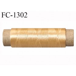 bobine fil polyester et soie très soyeux pour coudre ou broder couleur or gold longueur 50 mètres bobiné en france