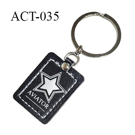 Porte clé effet cuir noir avec motif étoile argent inscription AVIATOR longueur 3.6 cm largeur 2.7 cm épaisseur 2 mm