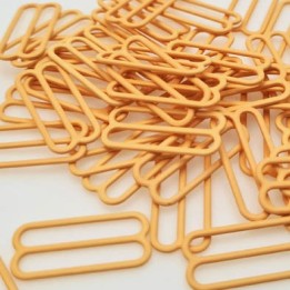 Le lot de 50 réglettes lingeries  abricot, métal plastifié .largeur intérieur 22 mm extérieur 24.4 mm Tarif dégressif