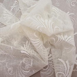 Destockage dentelle brodé  sur tulle extensible couleur ivoire très haut de gamme largeur 140 cm