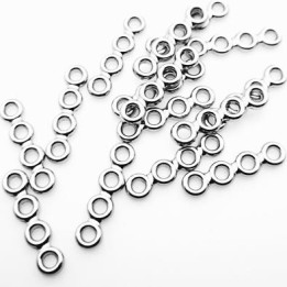 Le lot de 15 pièces décor ornement en métal couleur chrome largeur 27 mm hauteur  5.3 mm diamètre des trous 2.6 mm