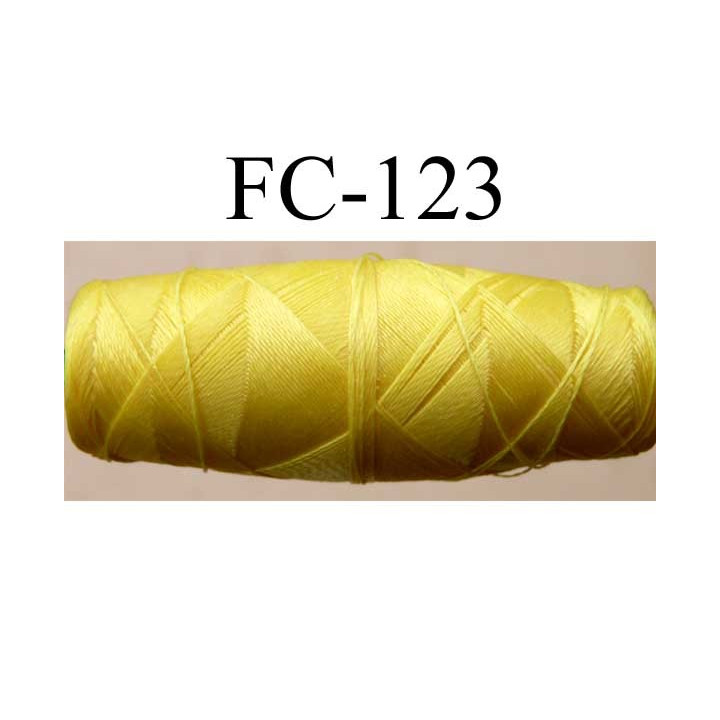 cocon bobine de fil nylon épaisseur 120/2 couleur jaune longueur 200 mètres largeur du cocon 4 cm diamètre 1.5 cm
