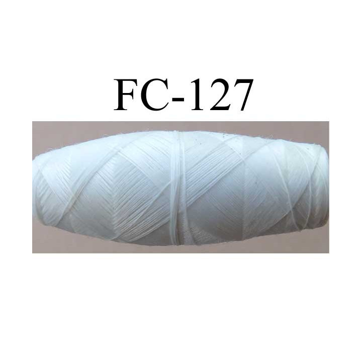 cocon bobine de fil polyester épaisseur 120/2 couleur blanc cassé longueur 200 mètres largeur du cocon 4 cm diamètre 1.5 cm
