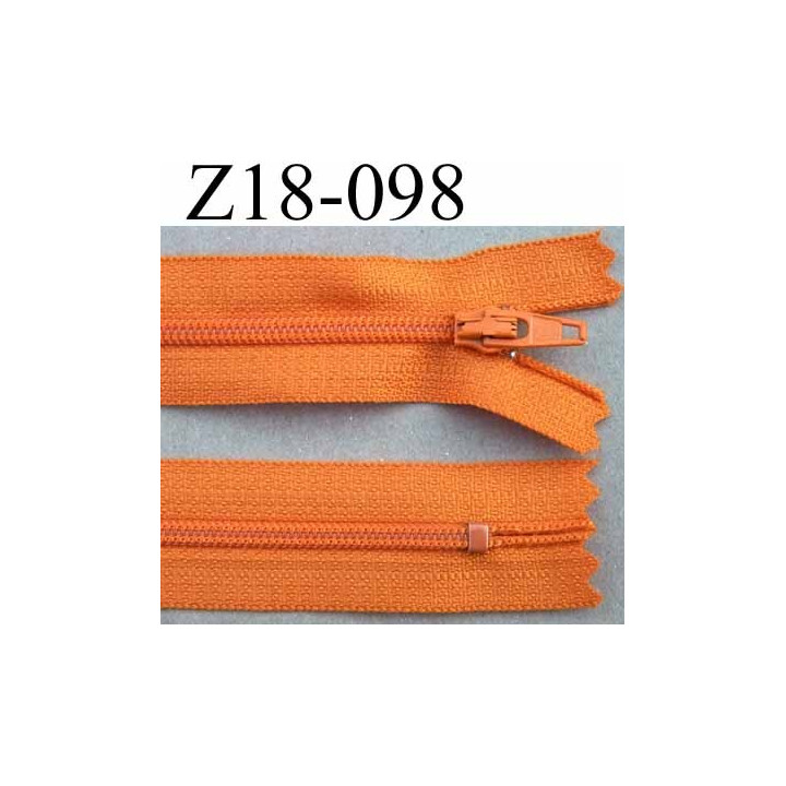 fermeture  éclair  longueur 18 cm couleur orange non séparable largeur 2.4 cm glissière en nylon largeur 4 mm curseur métal