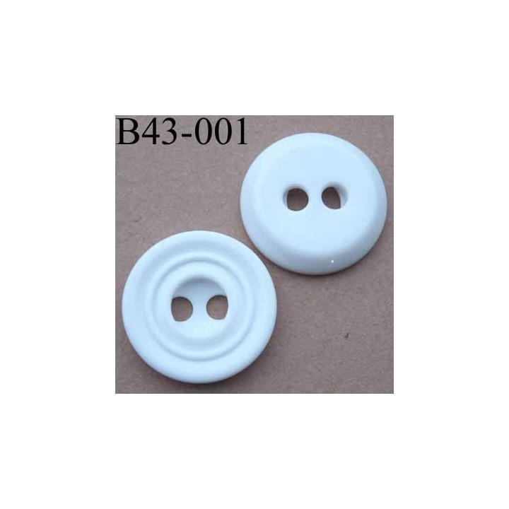 bouton  diamètre 43 mm  pvc couleur blanc rainuré 2 trous de 7 mm 