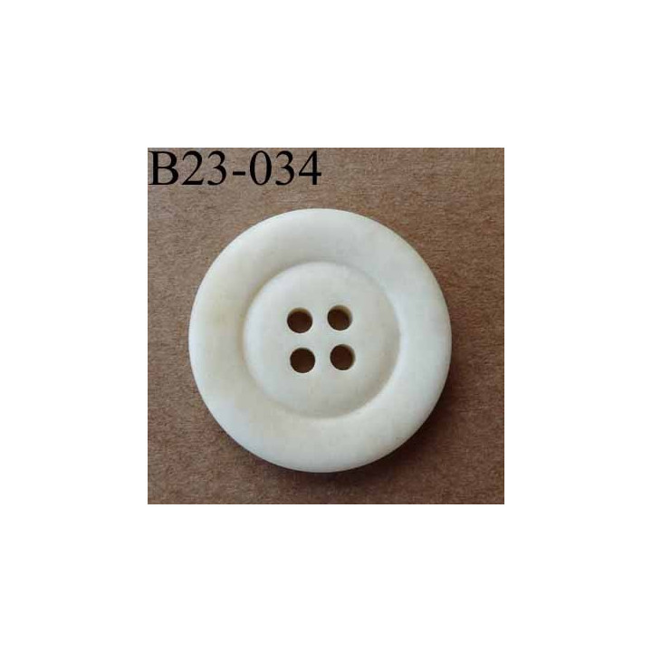 bouton 23 mm  couleur ivoire aspect ancien  4 trous diamètre 23 millimètres