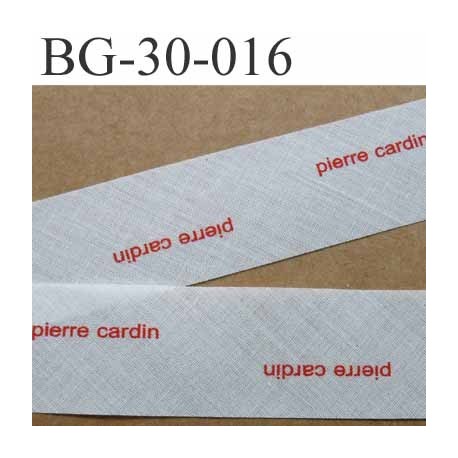 biais à plier PIERRE CARDIN couleur blanc cassé et texte en rouge largeur 30 mm prix au mètre