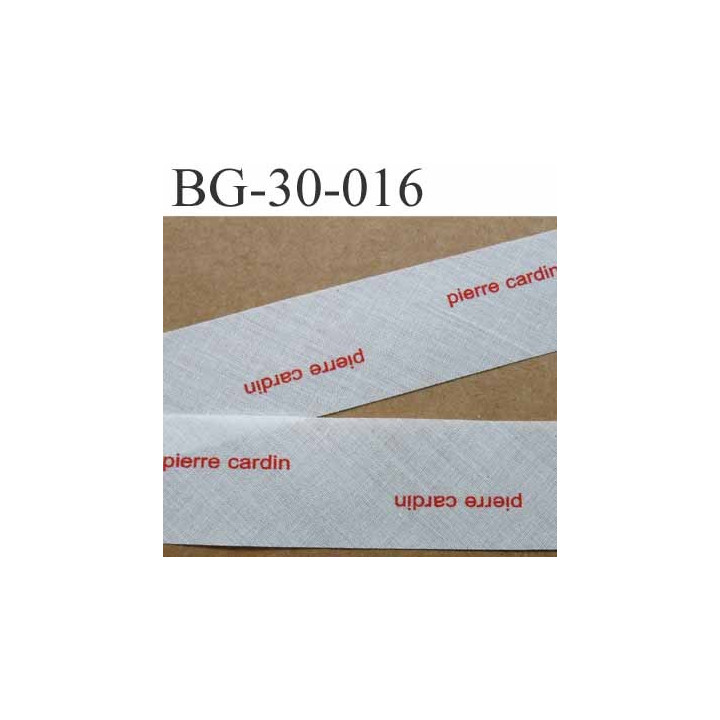 biais à plier PIERRE CARDIN couleur  blanc cassé et texte en rouge largeur 30 mm prix au mètre