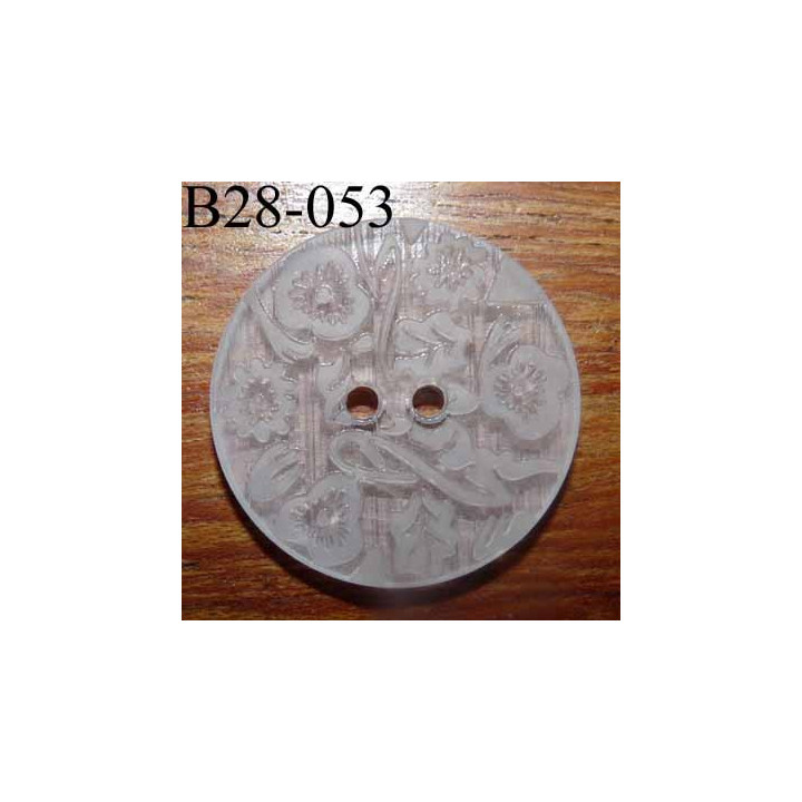 bouton fantaisie 28 mm  couleur blanc translucide avec motifs floraux en relief ton sur ton  2 trous  diamètre 28 millimètres