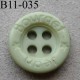 bouton diamètre 11 mm 4 trous couleur vert d'eau inscription JEAN BOURGET diamètre 11 mm