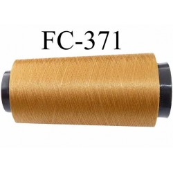 Cone fil polyester continu n° 70/2 couleur bronze doré clair brillant lumineux longueur cone de 1000 mètres bobiné en France
